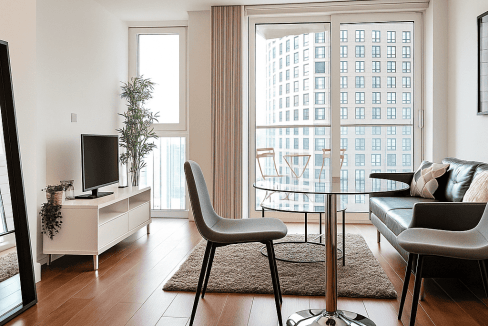 Bright, contemporary apartment interior with minimalist furniture and natural light.