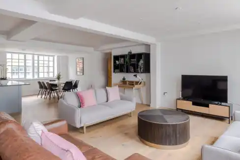 Modern living room in Farringdon Eyre Street Hill Apartments with stylish furniture and natural ligh.