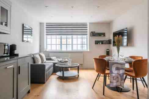 Bright living room with modern furniture and large window.