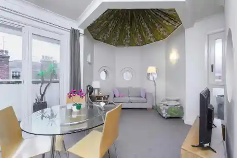 Interior view of Fitzrovia Langham Street Apartments showcasing contemporary design and bright livin.