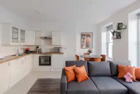 Bright and airy living space in Fitzrovia Foley Street Apartments with contemporary decor and natura.