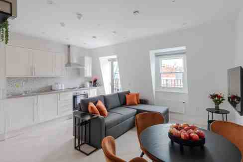 Bright Fitzrovia Foley Street balcony apartment with contemporary furnishings and natural light.