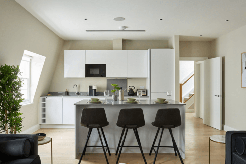 Contemporary kitchen in Chancery Lane Apartments with sleek design.