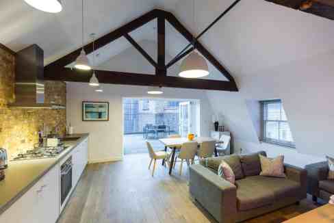 Interior view of Soho Rathbone Place Apartments with open-plan living and dining area.