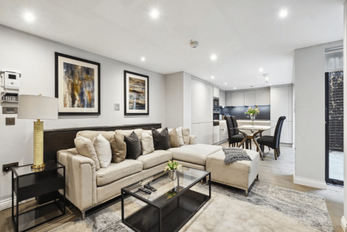 Elegant living space featuring contemporary furniture and artwork.