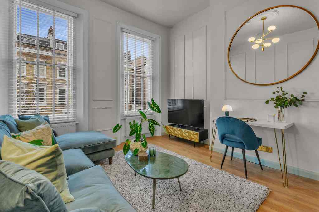 Bright living room in West Brompton serviced apartments with large windows and stylish decor.
