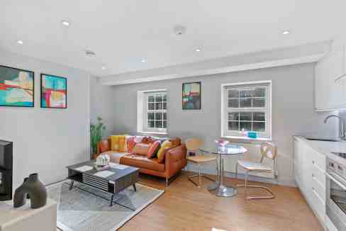 Bright living room in Fitzrovia Cleveland Street Apartments with stylish decor and natural light.