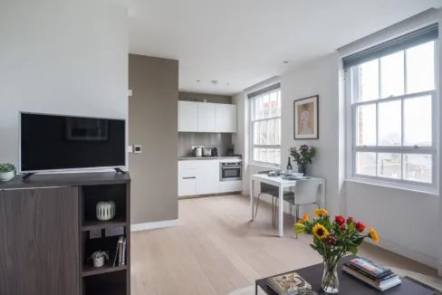 Bright, airy living space with large windows and contemporary decor.