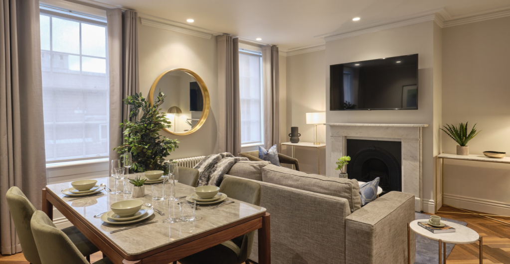 Bright and spacious living room with contemporary decor and large windows at Mayfair Darley House Ap.