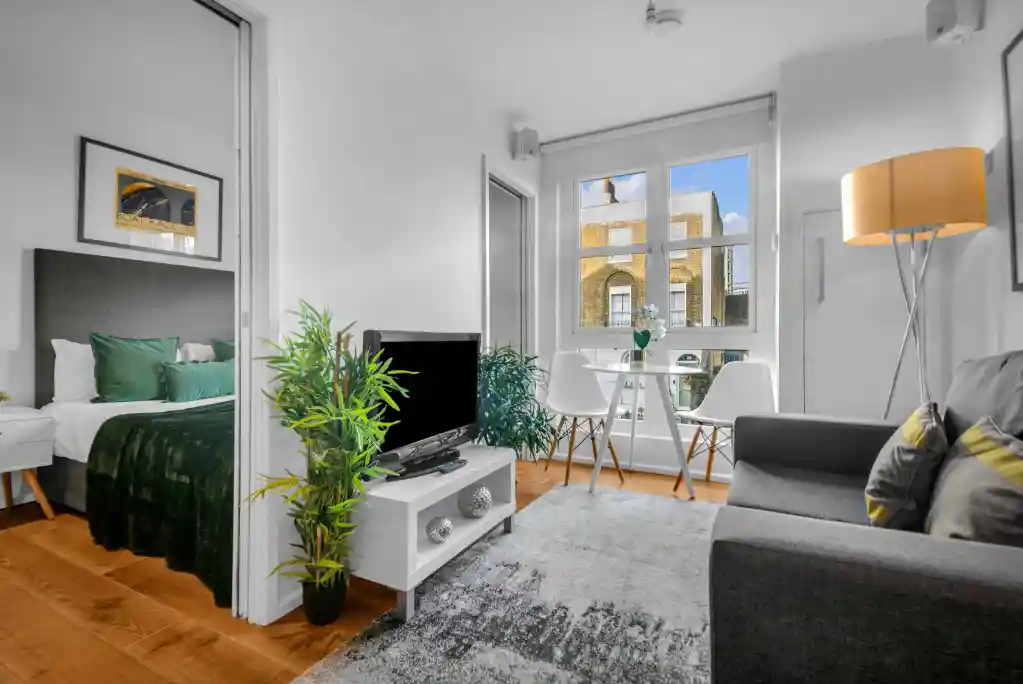 Bright and airy living space in Camden Road serviced apartments with contemporary furniture and natu.