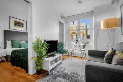 Bright and airy living space in Camden Road serviced apartments with contemporary furniture and natu.