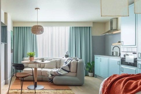 Bright and cozy living room in London Bermondsey Aparthotel with stylish decor and natural light.