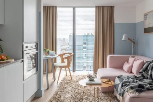 Bright interior of a contemporary apartment near Aldgate East Station with large windows and stylish.