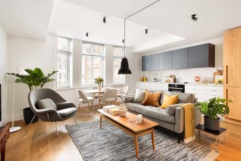 Modern living room at Marylebone Marlo Apartments with stylish furniture and natural light.