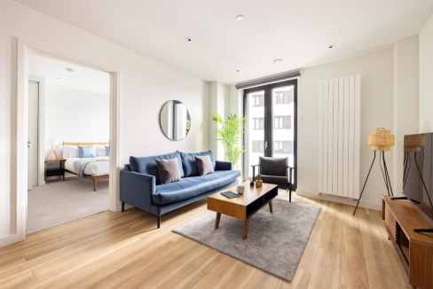 Bright living room in East Croydon serviced apartments with modern furniture and natural light.