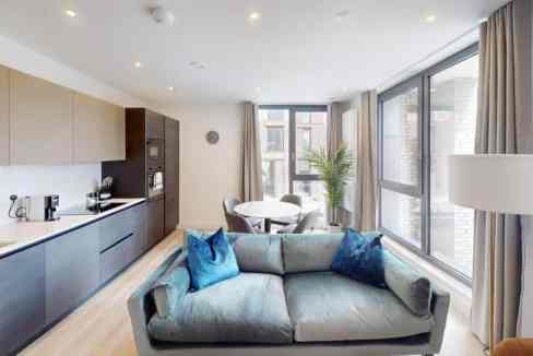 Brighton & Hove Boulevard Place Apartments living room with modern decor and large windows.