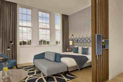 Aparthotel room in Islington London with contemporary design, large windows, and cozy furnishings.