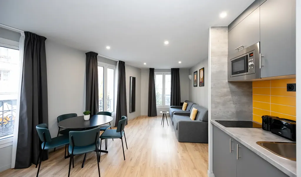 Bright, spacious apartment interior with contemporary furnishings and natural light.