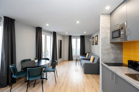 Bright, spacious apartment interior with contemporary furnishings and natural light.