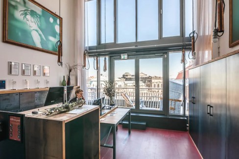 Bright interior with contemporary decor and city views from the lobby.