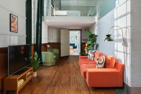 Modern living room with colorful sofa and stylish decor in Bethnal Green, London.