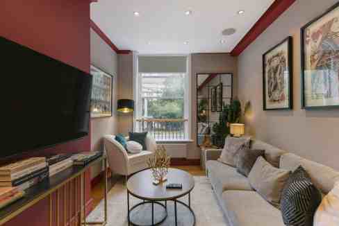 Stylish living room at Holborn Bloomsbury Square Apartments with contemporary furniture and decor.