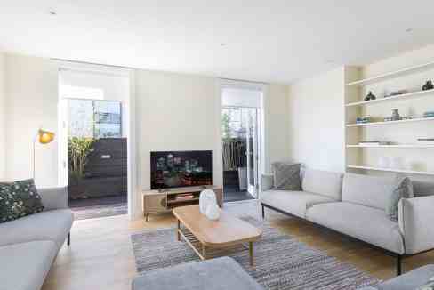 Bright and spacious living room with large windows and contemporary furniture in Marylebone Baker St.