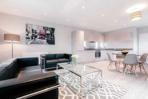 Modern living room with sleek furniture and contemporary decor.
