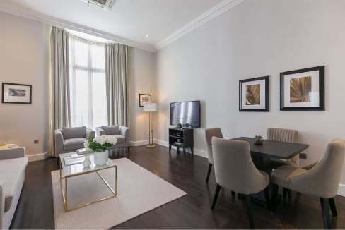 Stylish living room at Paddington Aparthotel featuring contemporary furniture, a flat-screen TV, and.