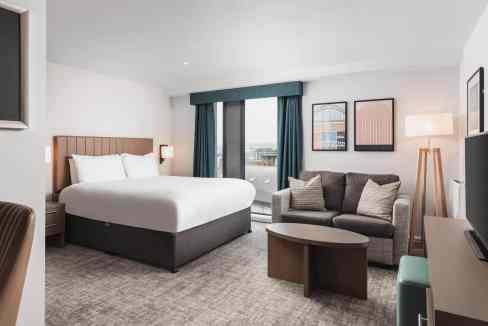 Modern hotel room with a comfortable bed and stylish decor in Newcastle.