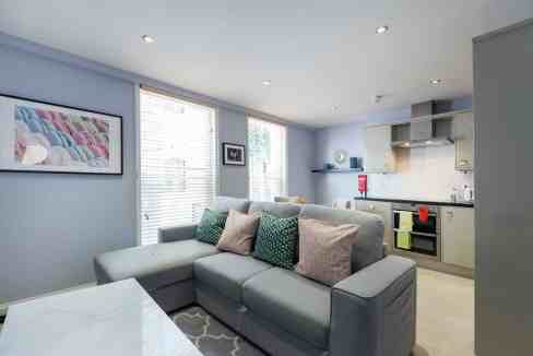 Interior view of Royal Opera Serviced Apartments with modern furnishings and bright natural light.