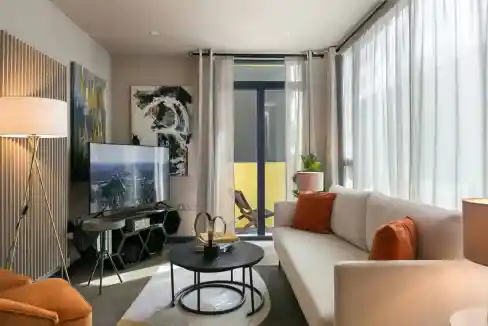 Modern living room with elegant decor and natural light in Holborn luxury apartments.