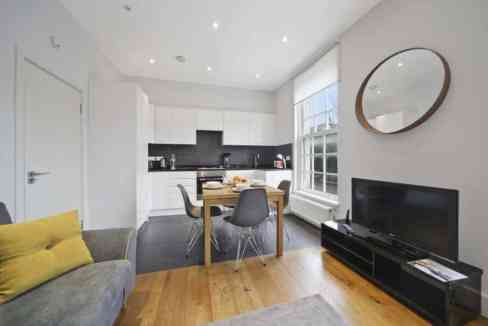 Modern living room in Euston Serviced Apartments with bright natural light and contemporary decor.