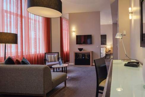 Stylish living room at Berlin Krausenstraße Aparthotel with comfortable seating and contemporary dec.