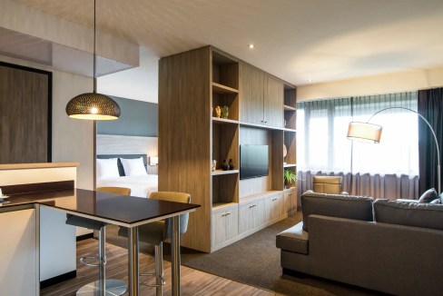 Modern living room in Amsterdam Amstelveen Uilenstede Aparthotel with stylish furniture and natural.