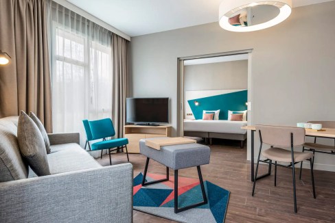 Contemporary Glasgow Riverside Clyde Aparthotel interior featuring cozy seating and modern decor.
