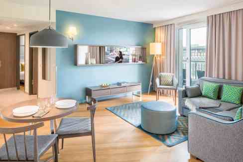 Modern apartment interior with city views in Frankfurt Skyline Plaza Aparthotel. Bright, stylish, an.