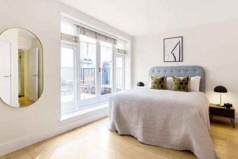 Modern bedroom in Soho Berwick Street Apartments with stylish decor and natural light.