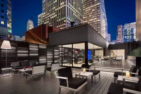 Rooftop lounge at Times Square Residences with city skyline views.
