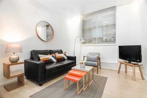 Blackfriars serviced apartment living room with contemporary furniture and natural light.