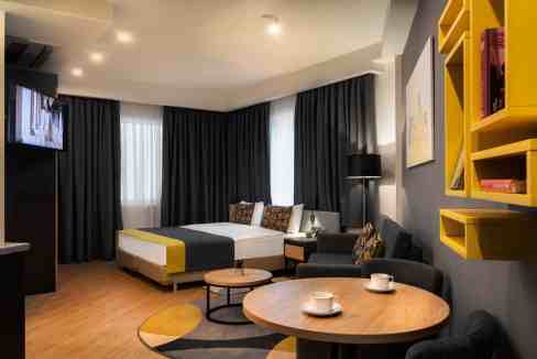 Modern Tbilisi Liberty Square Aparthotel room with stylish decor and comfortable furnishings.