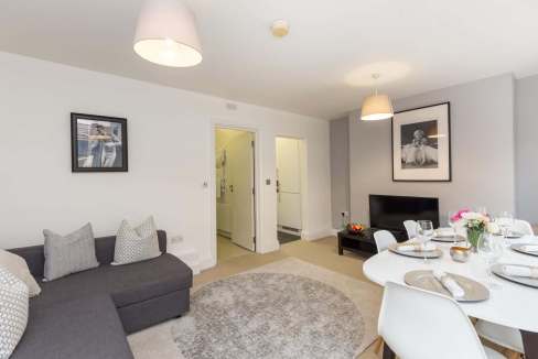 Elegant living space in Mayfair serviced apartments with contemporary decor and comfortable seating.