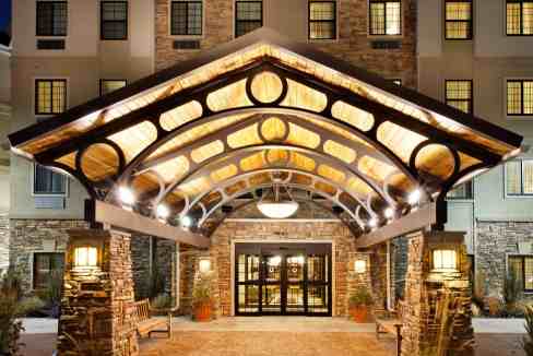 Elegant hotel entrance with warm lighting and decorative canopy in Pittsburgh.