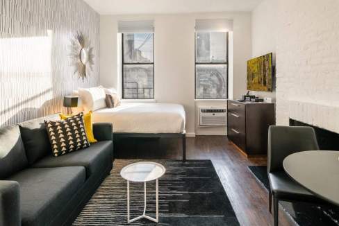 Stylish living space in Chelsea Jackson Square Apartments with contemporary decor.