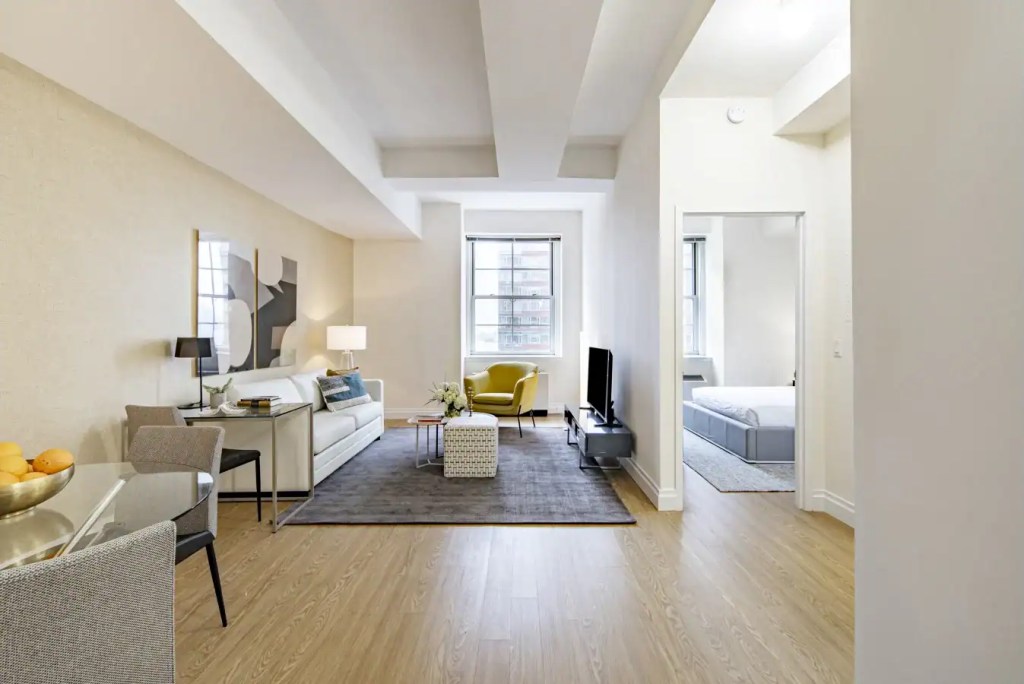 Spacious living room in Bowling Green Apartments with contemporary furniture and natural light.