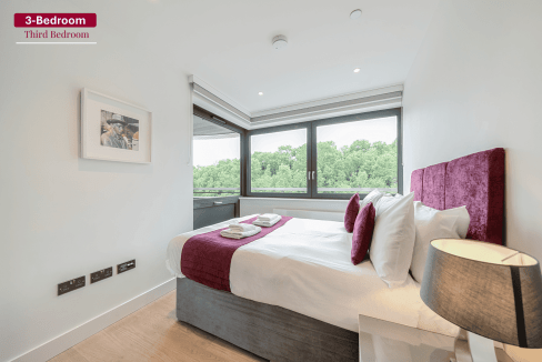 Spacious third bedroom in Wembley High Road Apartments featuring a comfortable bed, plush pillows, a.
