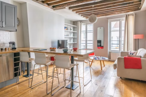 Bright dining space with wooden floors and exposed beams