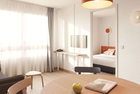 Bright and airy hotel room at Toulouse Jolimont Aparthotel with contemporary decor and natural light.