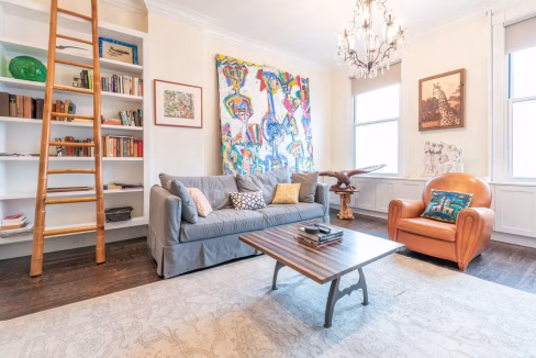bright lounge with several art pieces on wall