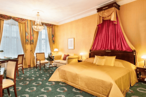 Hotel room at Weimar Goetheplatz Hotel with elegant decor and classic furnishings.